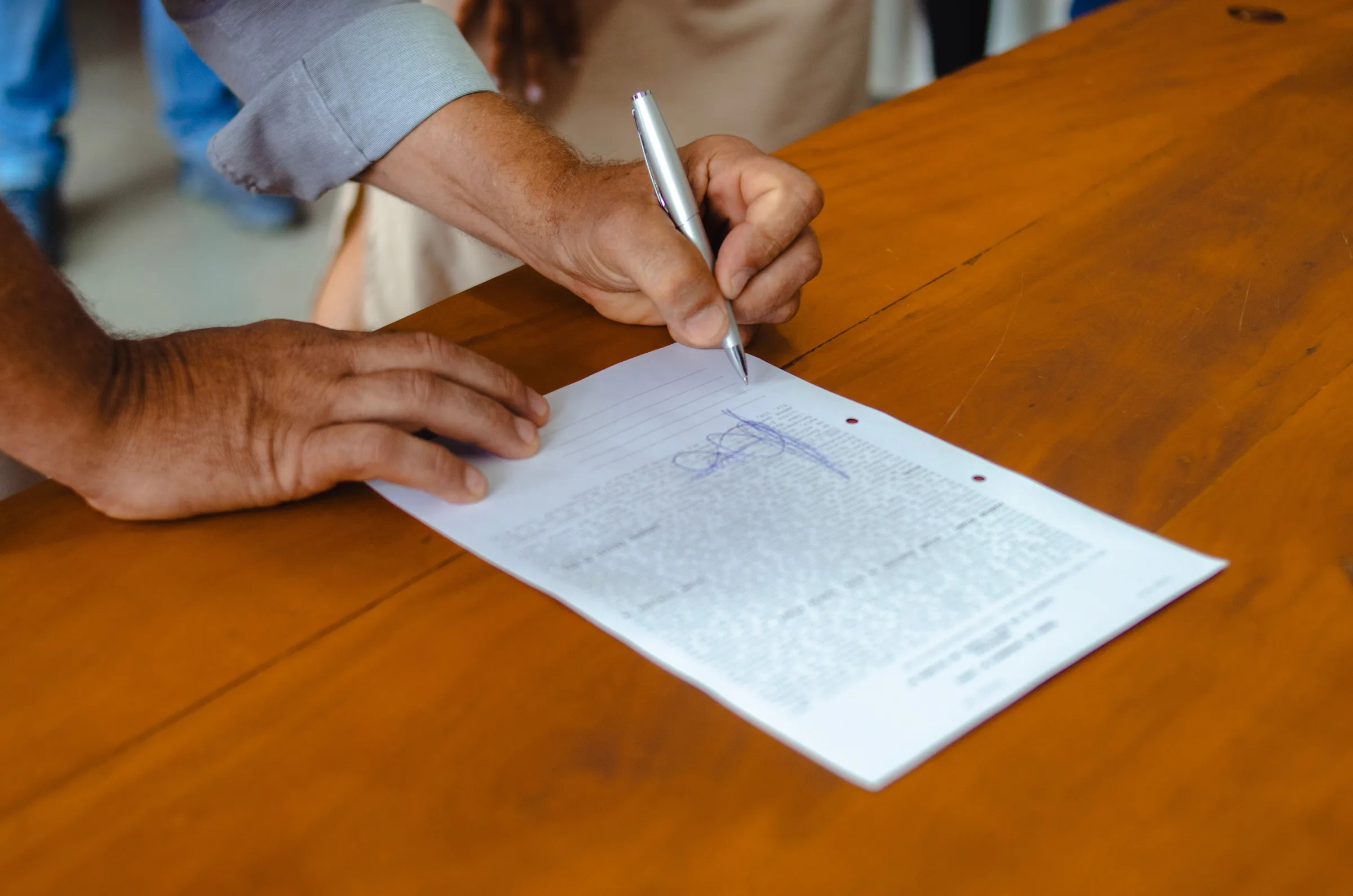 Signing RV financing paperwork at the Outpost Outfitters sales desk