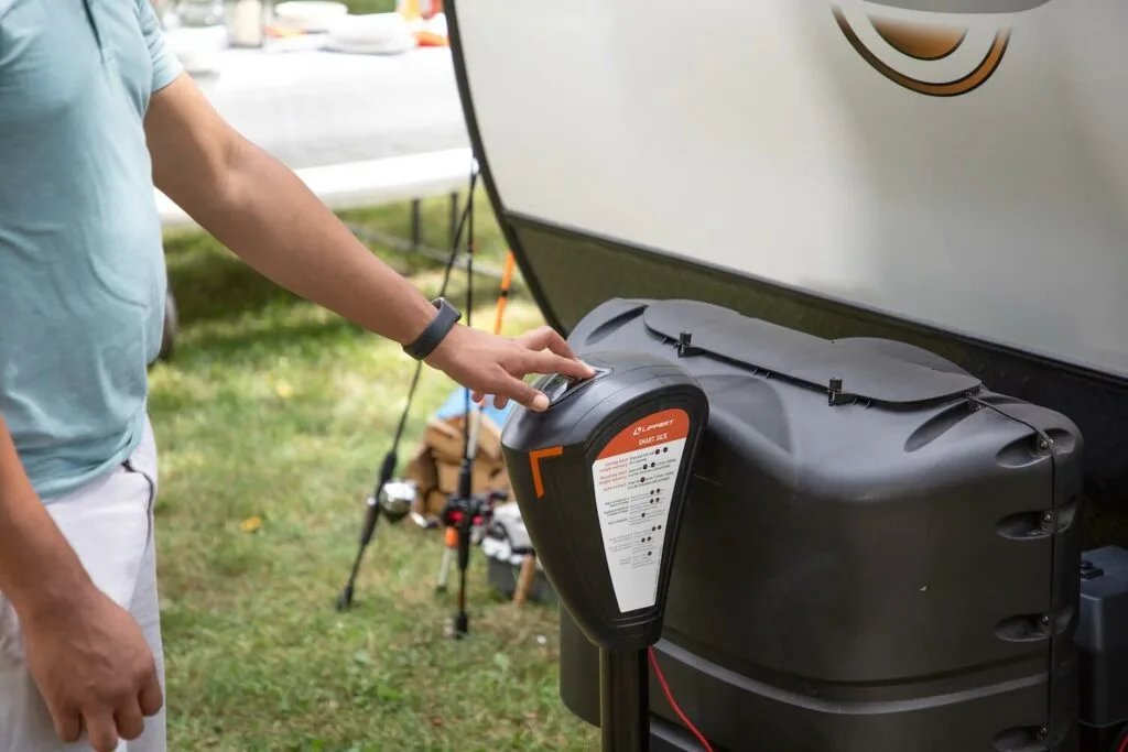 Camper reading the controls on a portable RV generator